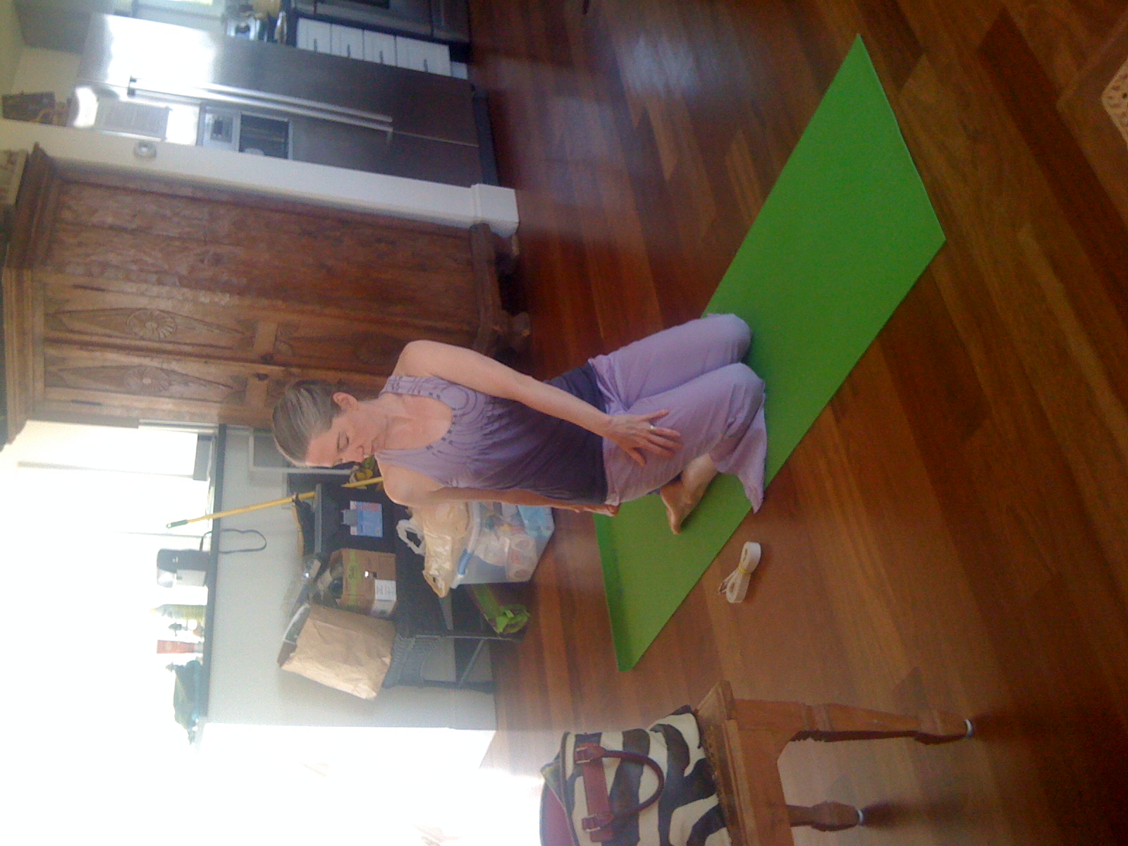 Shannon practicing yoga at home